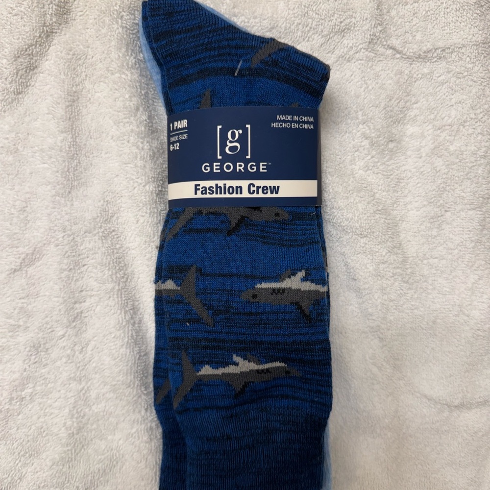Men’s socks, 2 pairs. Size 6-12. Sharks and marlin on them. Navy and light blue